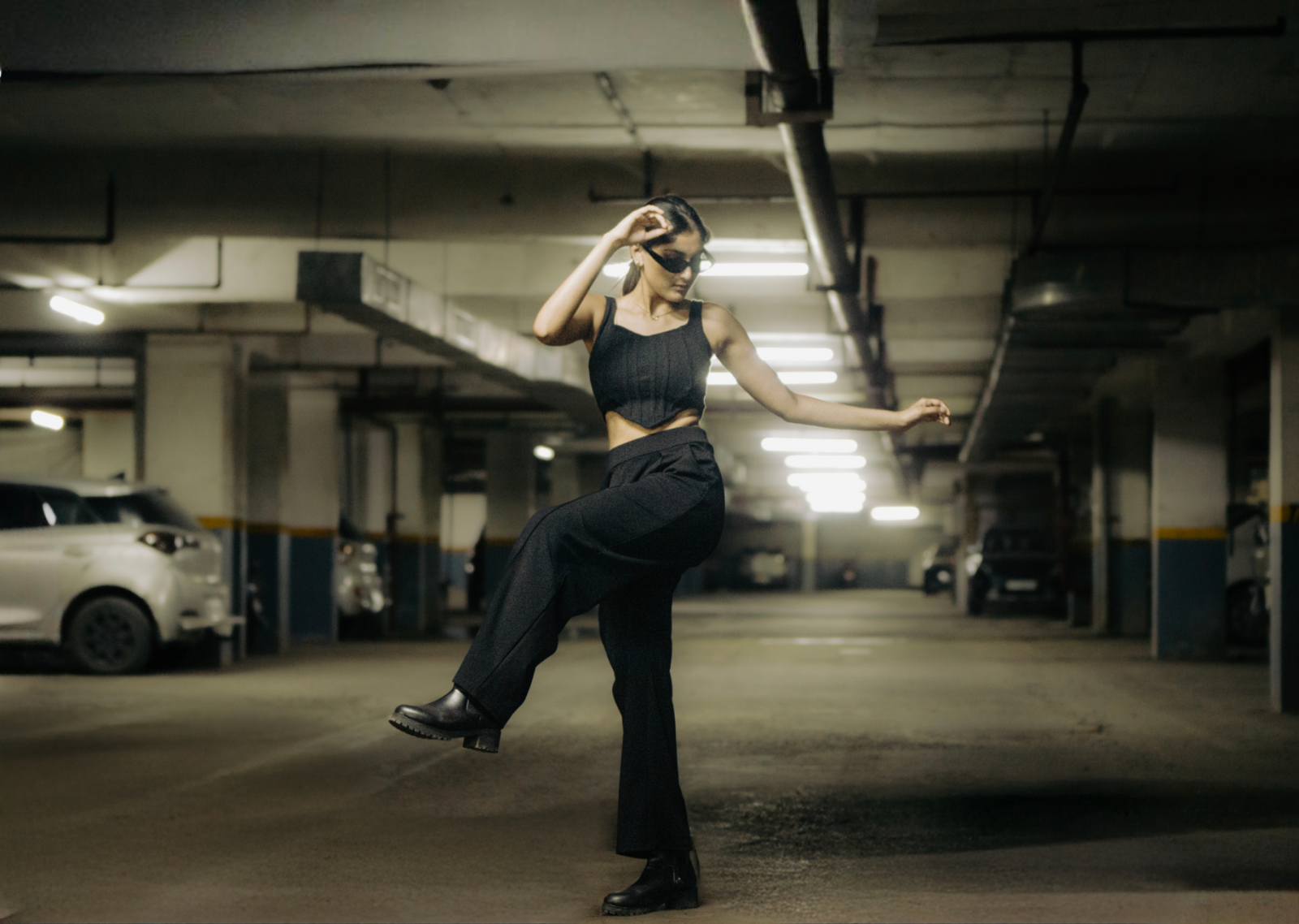 Person wearing black trip pants for everyday wear showcasing alternative streetwear style